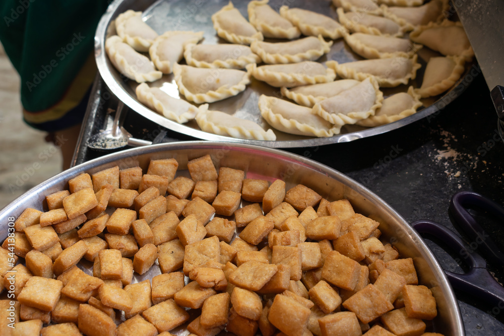 Plates full of crunchy snacks, faral during Diwali Deepawali festival. Shakkar para, shankar pali, gujiya, karanji, deep fried, flour, home made, healthy, cholesterol, indian, maharashtra, crunchy. Plates full of crunchy snacks, faral during Diwali Deepawali festival. Shakkar para, shankar pali, gujiya, karanji, deep fried, flour, home made, healthy, cholesterol, indian, maharashtra, crunchy.