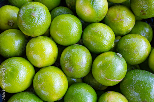 Fototapeta Naklejka Na Ścianę i Meble -  Fresh limes for sale on a market stall