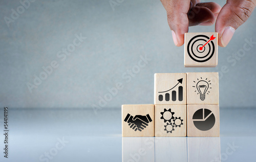 business goal concept, success icon on wooden cube