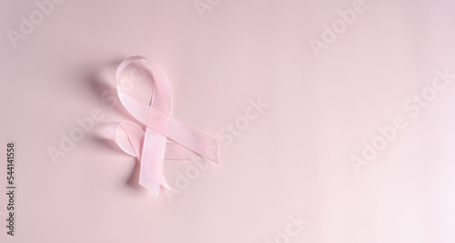 Pink ribbons on colored background, Breast cancer awareness, world cancer day, national cancer survivor day in february concept.