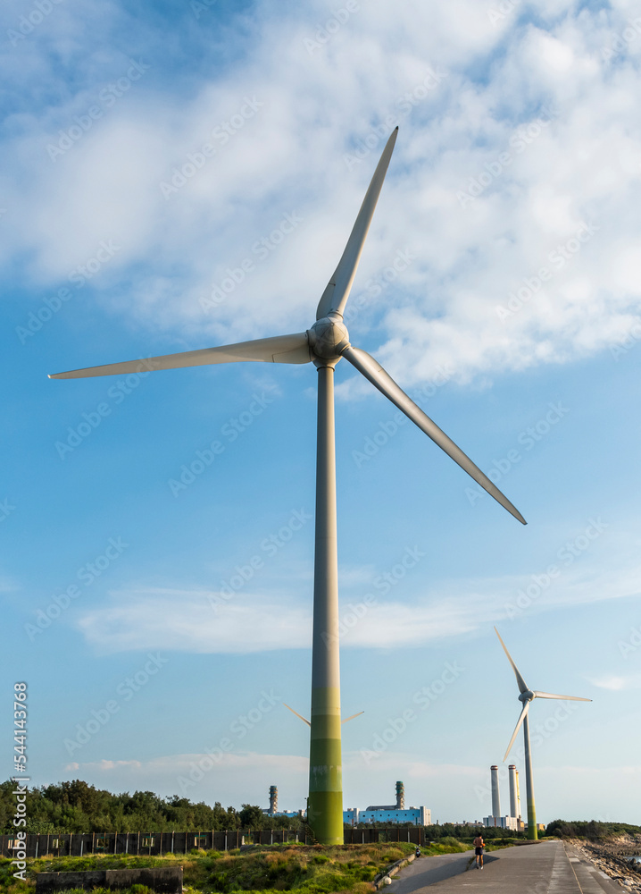 Close-up of wind power systems with the blue sky background. Close-up of wind power systems with the blue sky background.