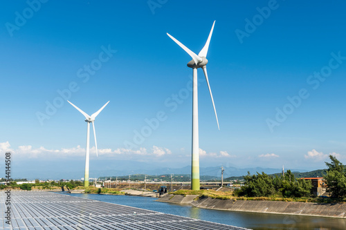 Combining wind power and solar power at Houlong Flood Detention Pond in Miaoli, Taiwan. photo