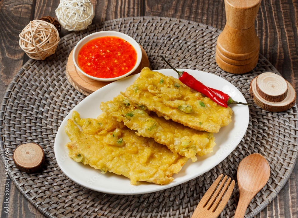 Fried tempeh with chilli sauce served in dish isolated on table side view of taiwan food