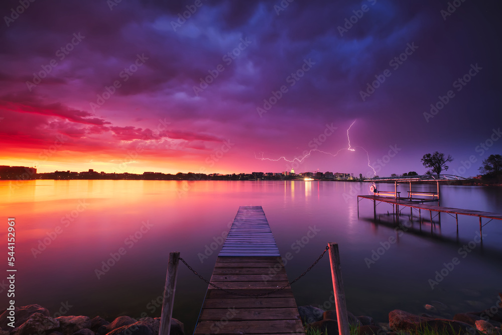 Lightning over Monona Bay during a colorful sunset. Madison, WI