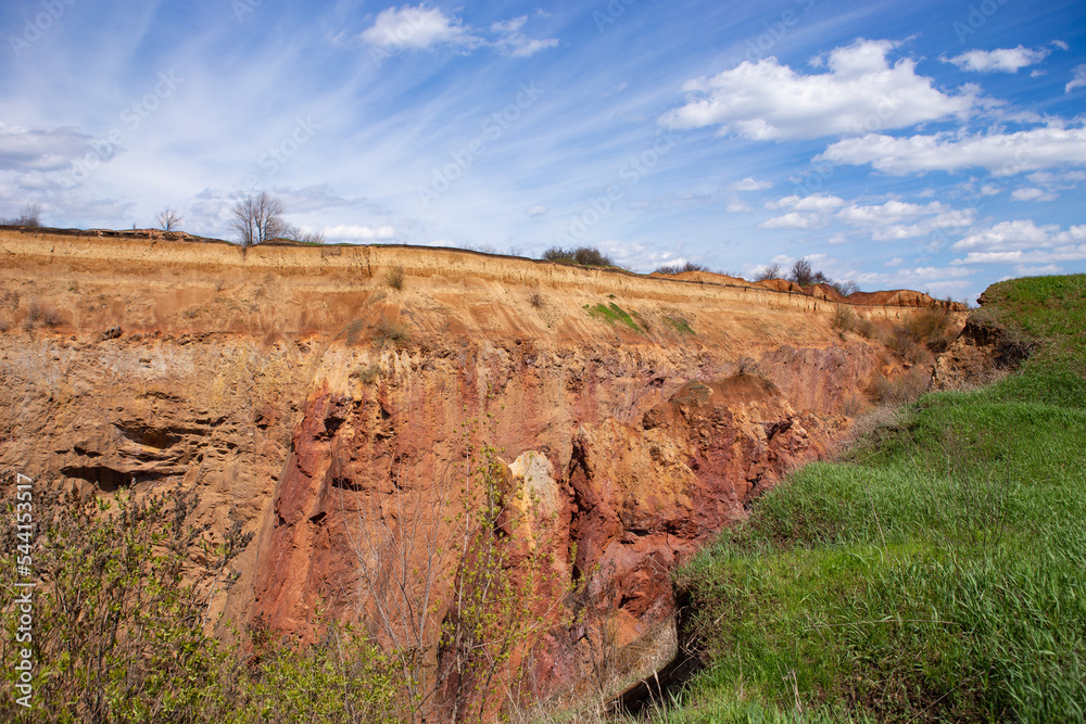 Soil erosion, sliding, and caving. Inside the landslide is rock ...