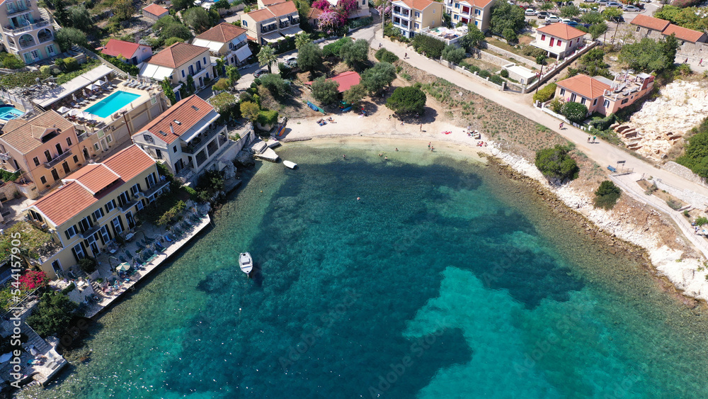 Aerial drone photo from iconic picturesque fishing village and bay of Fiskardo with beautiful traditional houses of Ionian architecture, Cefalonia island, Greece