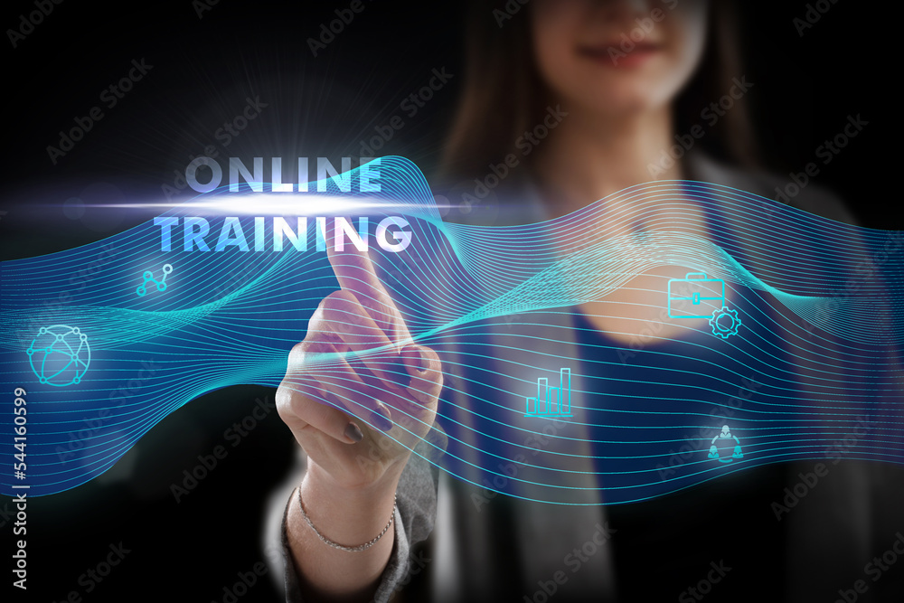 Business, Technology, Internet and network concept. Young businessman working on a virtual screen of the future and sees the inscription: Online training Business, Technology, Internet and network concept. Young businessman working on a virtual screen of the future and sees the inscription: Online training