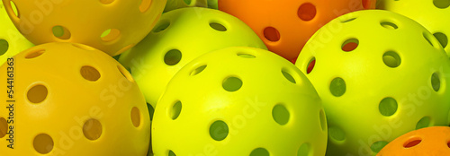 Colorful group on Pickleballs.  Yellow. Orange and green