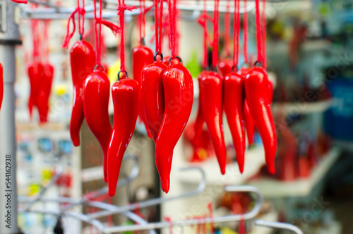 A traditional Neapolitan souvenir on the oudau - cornetto portafortuna. Red pepper or horn is one of the oldest mascots. Horizontal orientation. Selective focus. photo