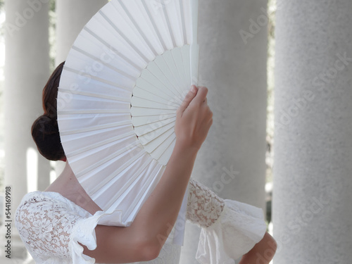 Flamenco dancer with white fan photo