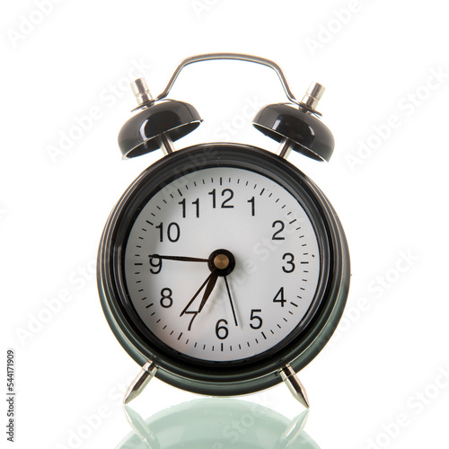 Black alarm clock at seven