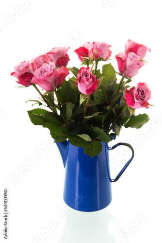 Bouquet pink roses in vintage coffee pot