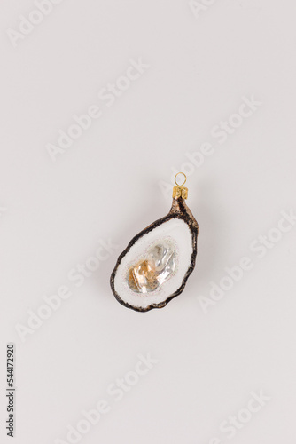 A single bauble in the shape of an oyster with pearls inside. photo