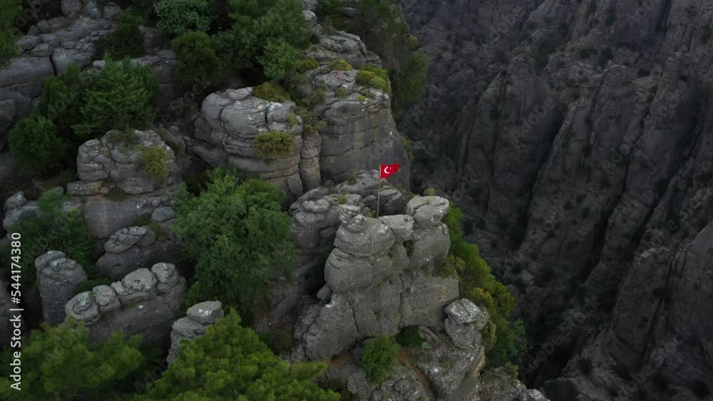 Sheer cliffs of Tazi Canyon in Turkey in the morning. The flag of Turkey on the rock. High quality 4k footage Sheer cliffs of Tazi Canyon in Turkey in the morning. The flag of Turkey on the rock. High quality 4k footage