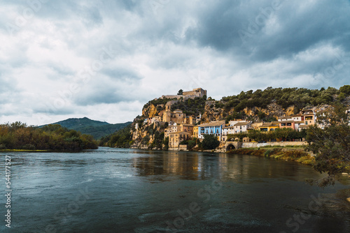 Miravet, village near the river on a cloudy day evolved in the nature