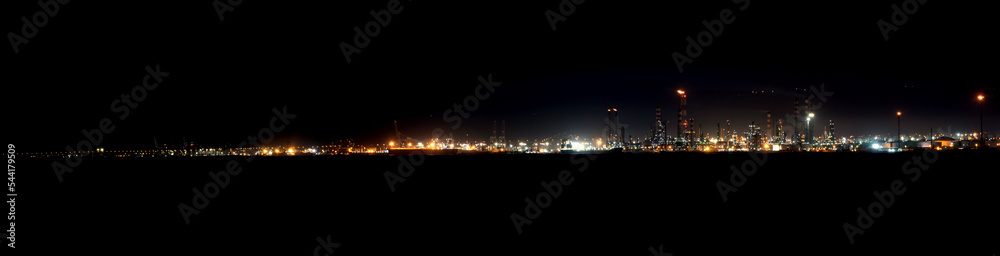 Panoramic view of industrial area at night in Gulf of Izmit Turkey. Factory lights at night.