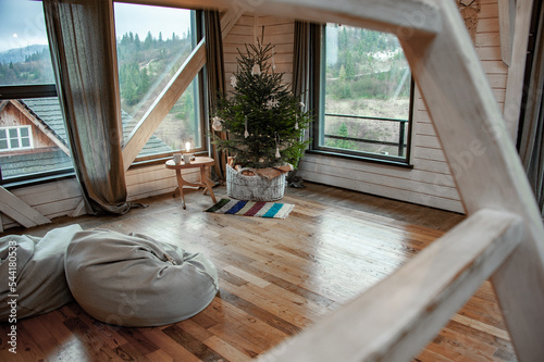 Ukrainian Carpathians in the window of a country house. Lamp in traditional style. National style. Christmas