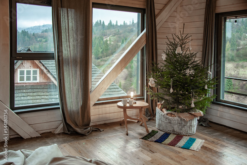 Ukrainian Carpathians in the window of a country house. Lamp in traditional style. National style. Christmas