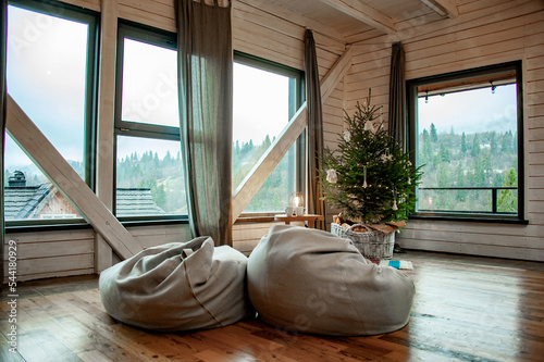 Ukrainian Carpathians in the window of a country house. Lamp in traditional style. National style. Christmas