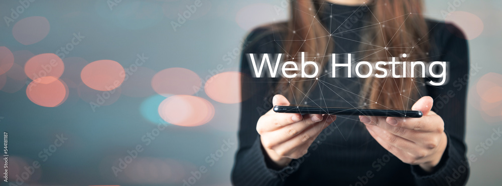 Web hosting and phone in a woman's hand. Web hosting and phone in a woman's hand.