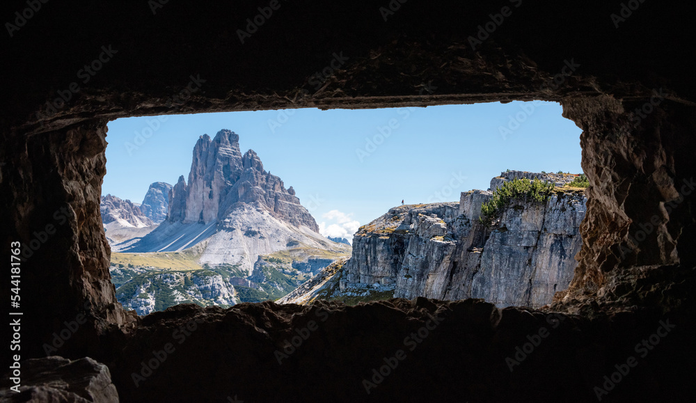 View out of an old military tunnel window towards the iconic Three Peaks mountain in the Dolomite Alps, former Austrian-Italian front in the First World War, Autonomous province of South Tirol