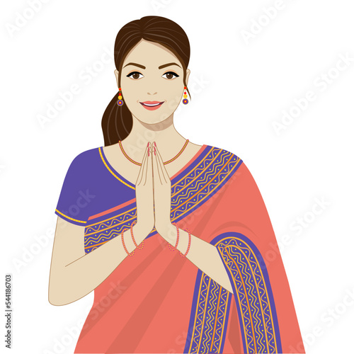 Young woman in a saree greeting namaste