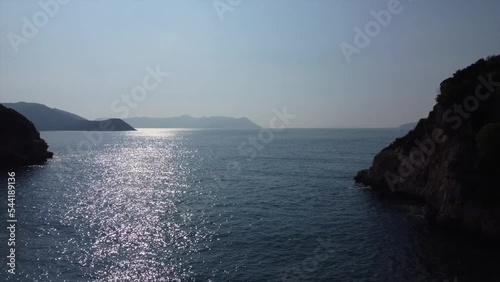 Aerial view of gorgeous Buyuk Chakil (black pebble) beach with emerald clear waters and boats, Kas, Turkey photo