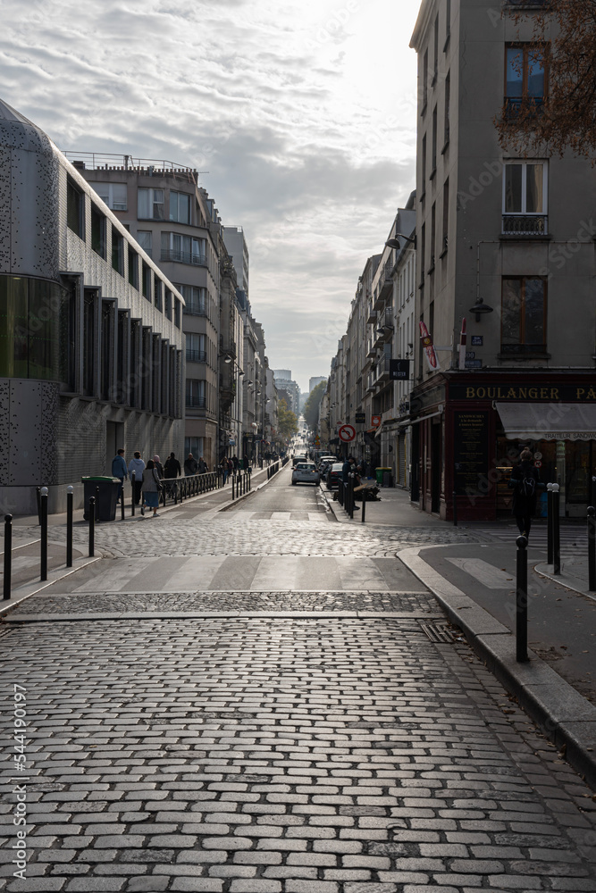 Paris, France - 10 31 2022: Ourcq canal. Backlit view of a street