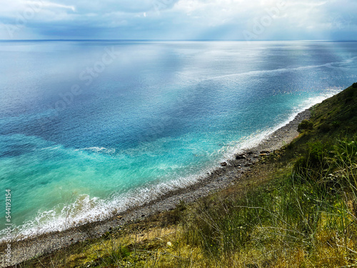 seashore weather clouds coastal ocean shore blue harbor cove water sea sunshine