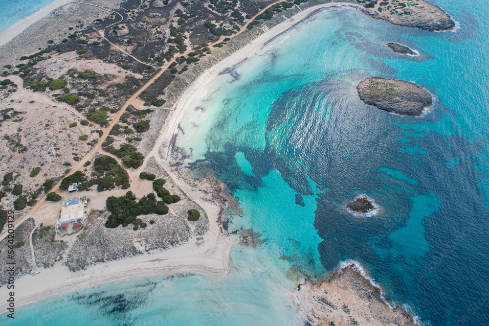 Best beach in Europe with turquoise waters with sand and rocks seen from the air with a drone.