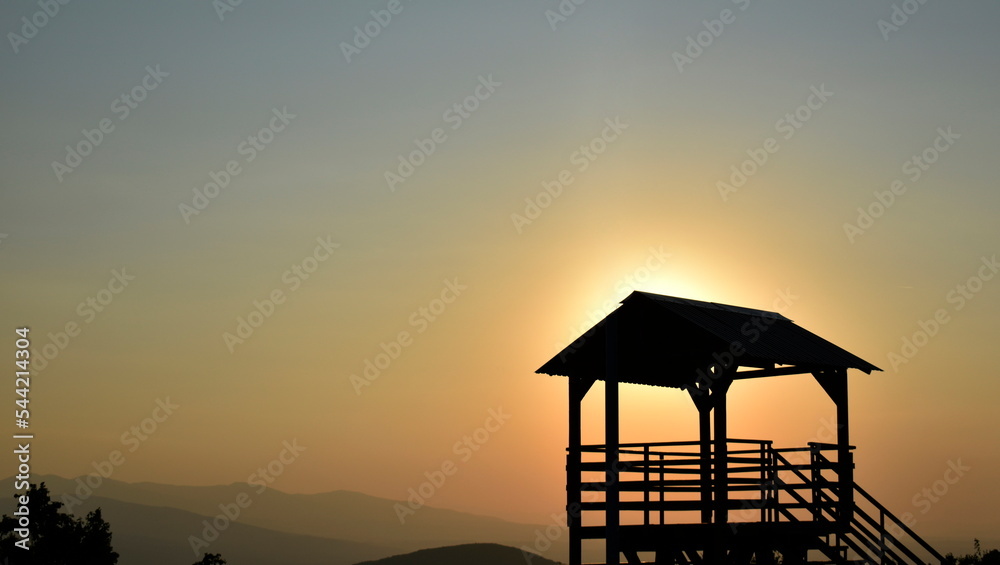 Sunset and watchtower on the hill Sunset and watchtower on the hill
