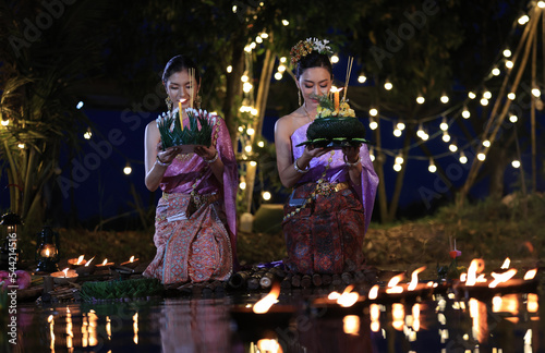 Photography Cute and beautiful Asia woman with traditional dress hold Krathong  Kratong, Loy Krathong Traditional Festival in Thailand