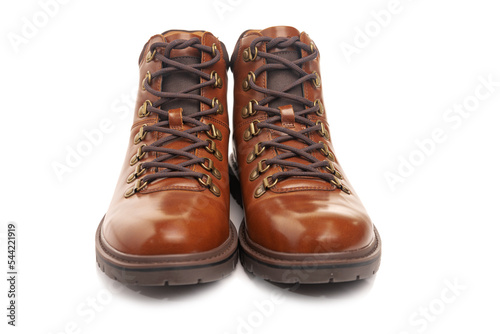 men's leather brown boots for winter or autumn hiking on a white background. Men's fashion, trendy shoes. Close-up
