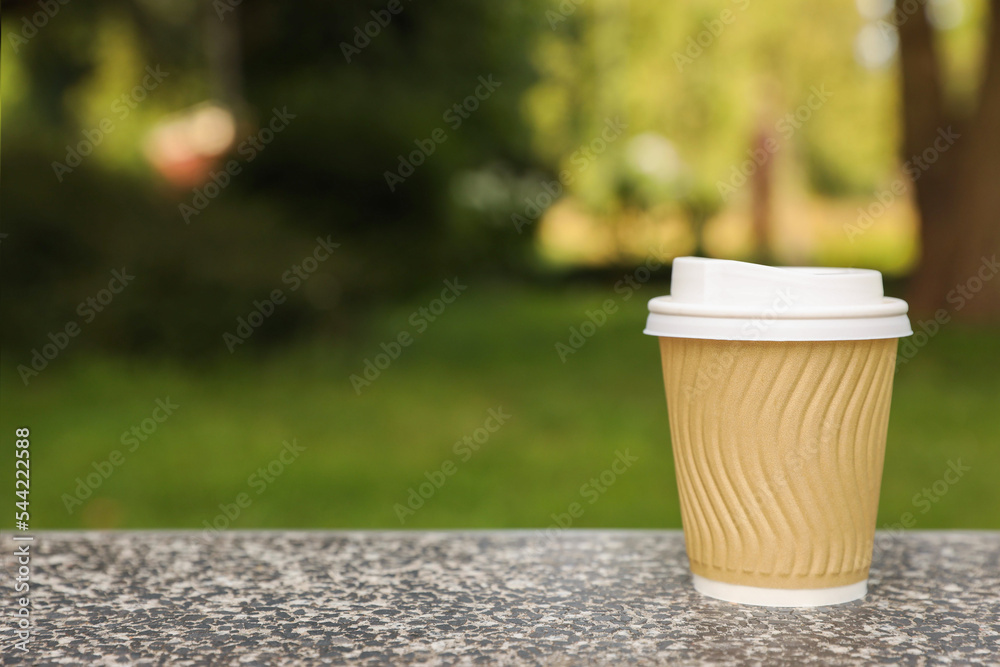 Paper cup on parapet in park, space for text. Coffee to go Stock Photo ...