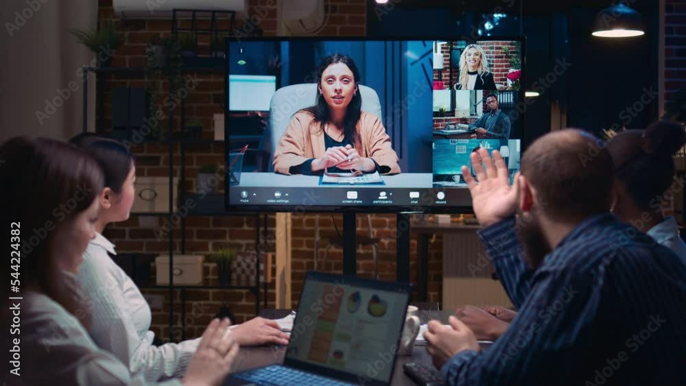 Remote team business meeting, coworkers talking in videocall at night time. Diverse people chatting in teleconference, colleagues brainstorming in videoconference in office zoom in
