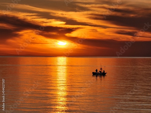 fishing boat at sunset © sadiq