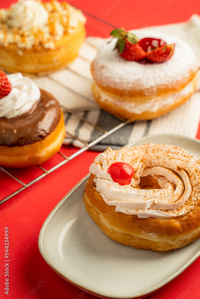 Delicious donuts with red background Delicious donuts with red background
