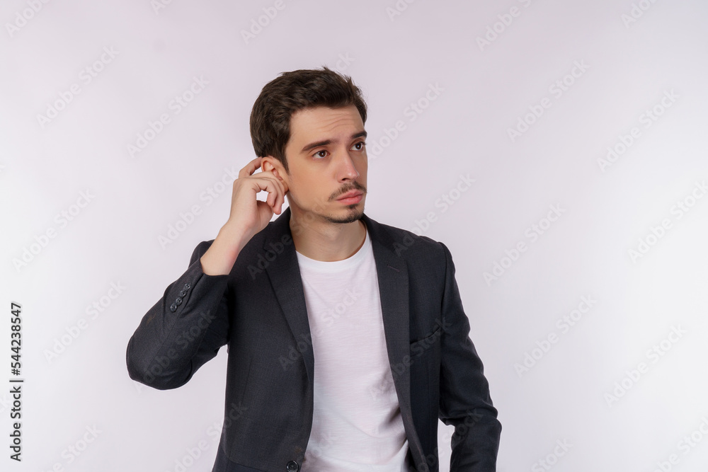 Portrait of thinking man surrounded by question mark on isolated background Portrait of thinking man surrounded by question mark on isolated background