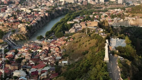 Kartlis Deda (Mother of Georgia) Monument in Tbilisi city, aerial orbit view photo
