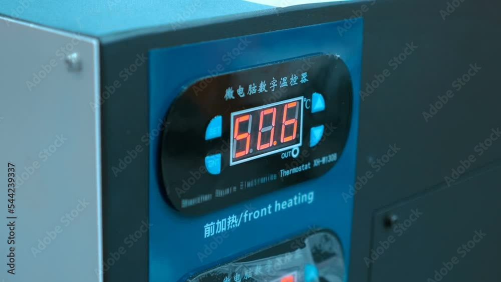 Digital display with changing digits on the panel of industrial equipment functions. Closeup Digital display with changing digits on the panel of industrial equipment functions. Closeup
