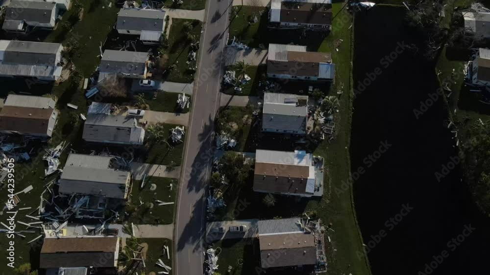 downward aerial view of the destruction caused at a mobile home park atter hurricane Ian. Debris is everywhere below downward aerial view of the destruction caused at a mobile home park atter hurricane Ian. Debris is everywhere below
