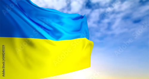 Ukraine flag on background of sunset or sunrise
