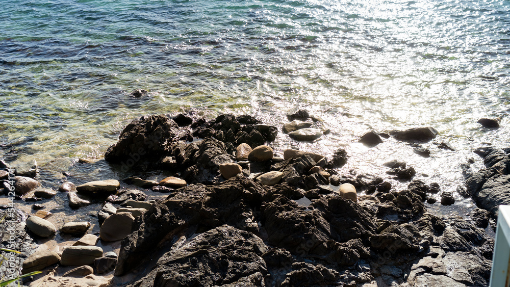 Sea rocks in the bright sunshine.