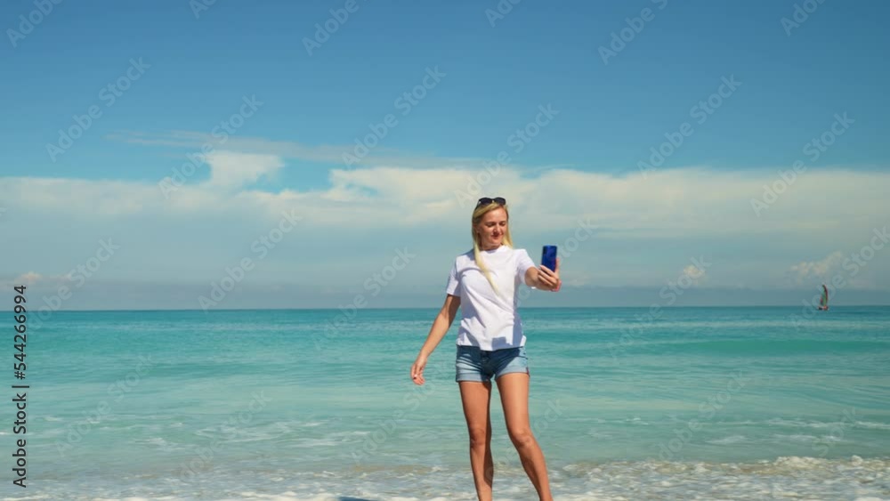 travel, tourism, emotions, expressions and people concept - happy smiling young woman taking selfie over exotic tropical beach background travel, tourism, emotions, expressions and people concept - happy smiling young woman taking selfie over exotic tropical beach background