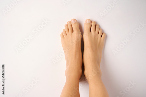 Female bare feet isolated on white background
