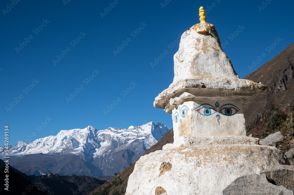 An ancient Tibetan Buddhism stupa on the trail to Everest Base Camp in Nepal. Tibetan Buddhism is widely used in Nepal by Tibeto-Burman tribes.