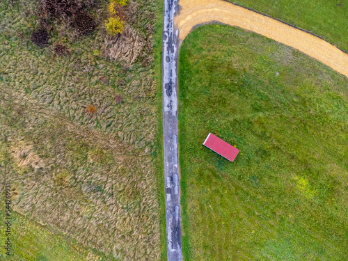 Obraz na płótnie Aerial view. Landscape seen from above. Trees, forest, path, meadow, nature. Photo from a drone. w salonie