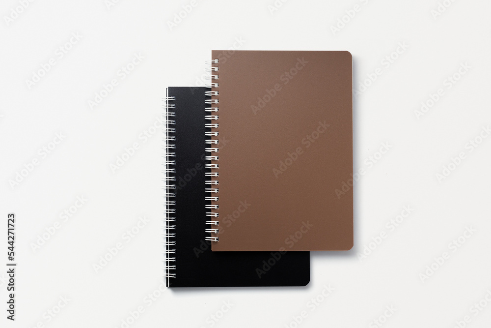 School notebook on a white background, spiral notepad on a table. flatlay School notebook on a white background, spiral notepad on a table. flatlay