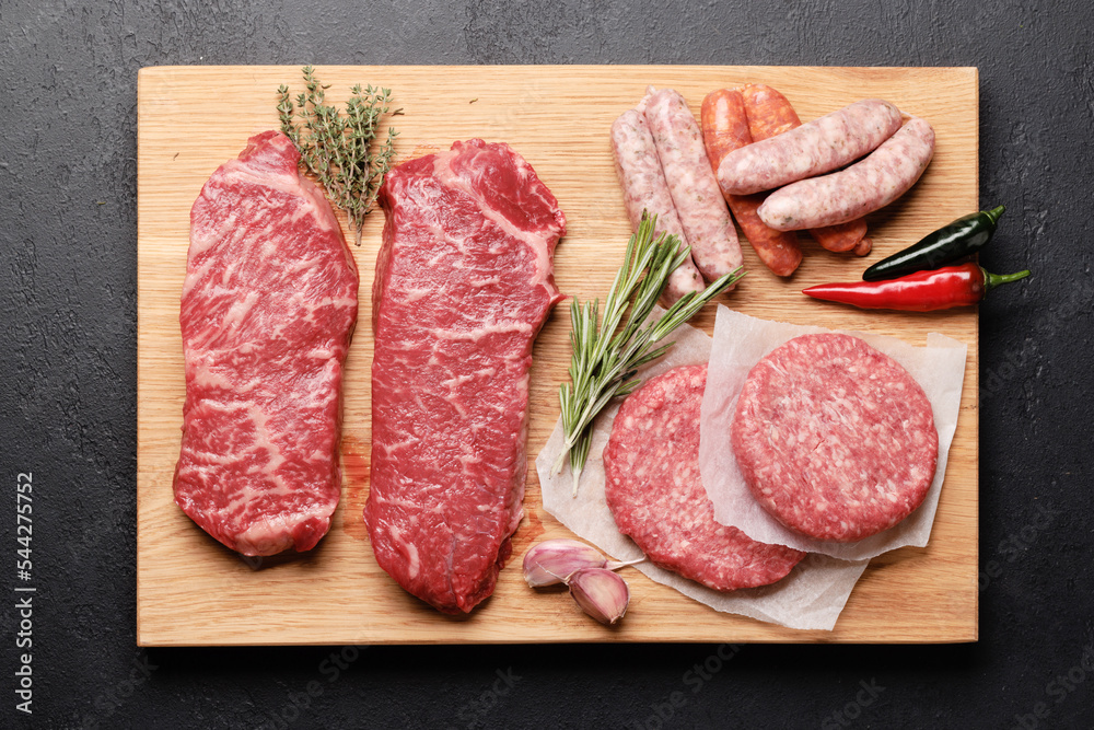 Various raw meat. Steaks, sausages, burgers and spices Various raw meat. Steaks, sausages, burgers and spices