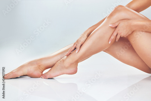 Fényképezés Skincare, beauty and legs of woman in studio, isolated on white background for wellness, body care and grooming